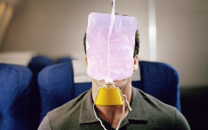 How do oxygen masks drop down on airplanes and how many of them?